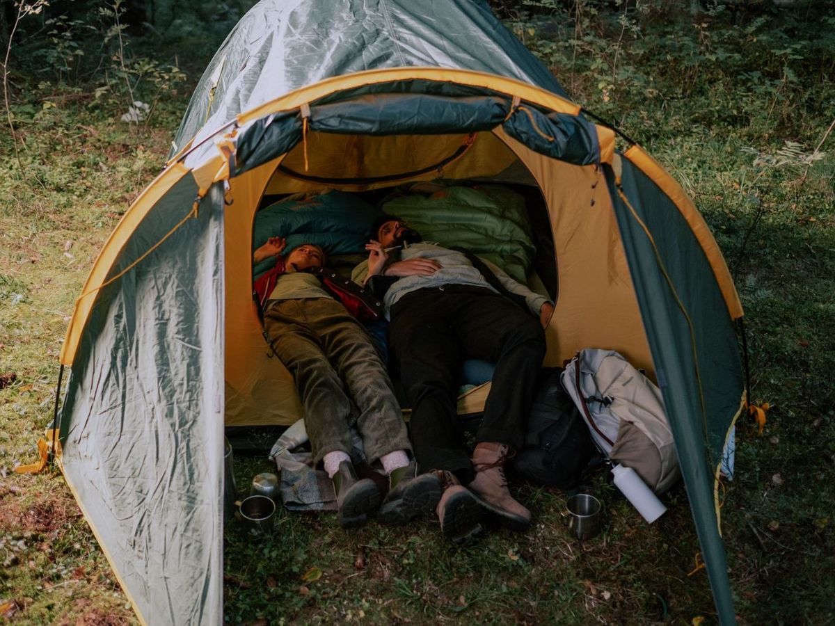 A sleeper lying flat and open under a clear night sky